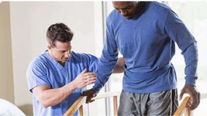 Physician providing physical therapy to a patient