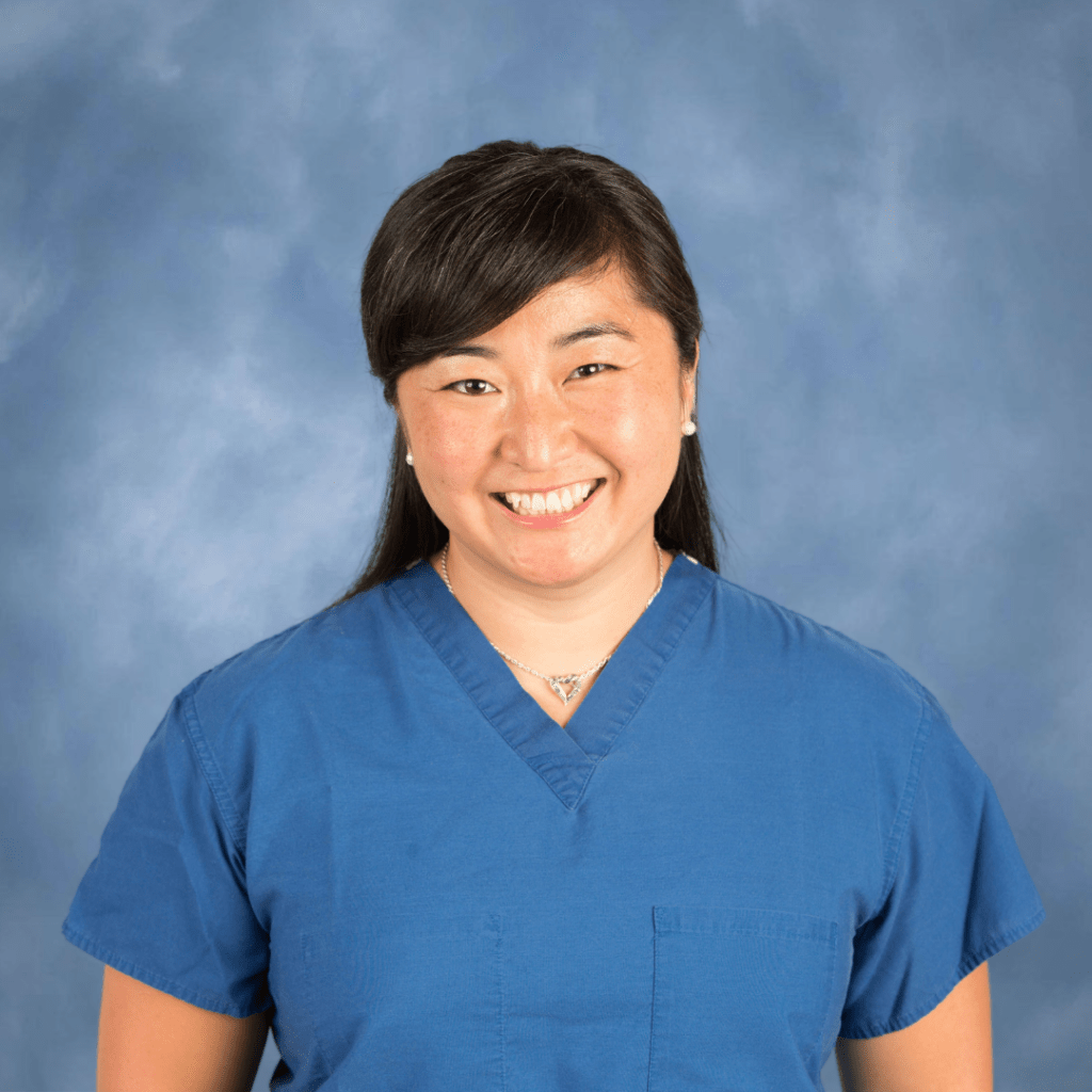 Mary Caroline Stancukas, a Board-Certified Podiatrist in Texas, smiling for a picture.